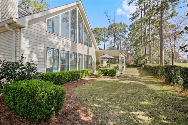 view of property exterior featuring a yard