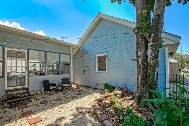 back of house featuring a patio and fence