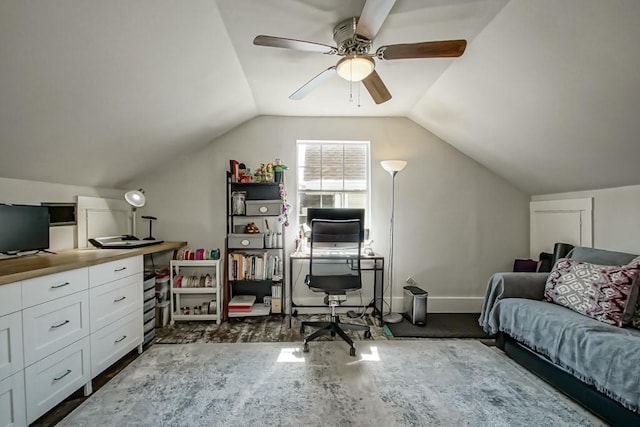 office with baseboards, lofted ceiling, dark wood finished floors, and a ceiling fan