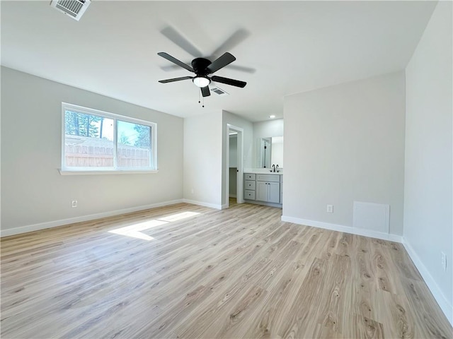 interior space featuring visible vents, baseboards, and light wood-style floors