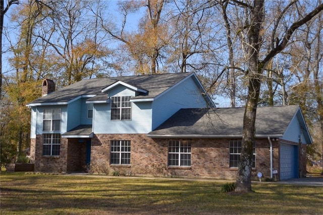 traditional home with a front lawn, brick siding, a garage, and a chimney