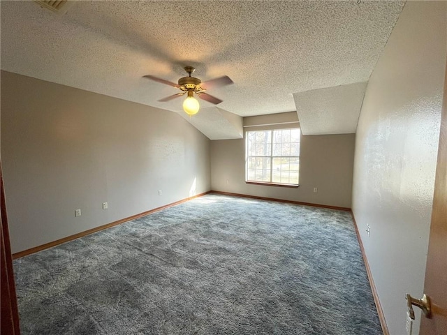 bonus room featuring baseboards, lofted ceiling, ceiling fan, and carpet flooring