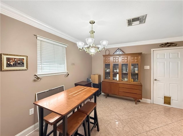 dining area with ornamental molding, baseboards, visible vents, and a chandelier