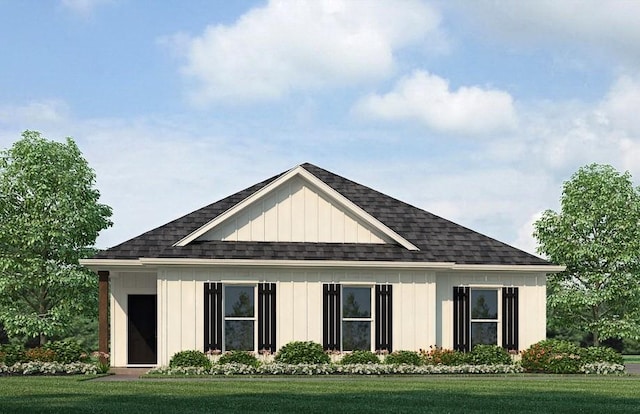 view of front of house featuring a front lawn, board and batten siding, and roof with shingles