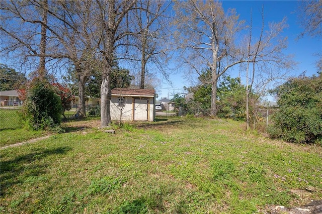 view of yard featuring a fenced backyard, an outbuilding, and a storage shed