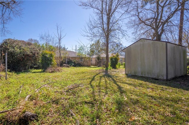 view of yard with an outdoor structure and a storage unit