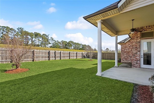 view of yard featuring a ceiling fan, a patio area, and a fenced backyard