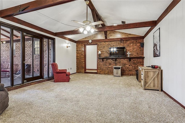 carpeted living room with vaulted ceiling with beams, a ceiling fan, baseboards, and brick wall