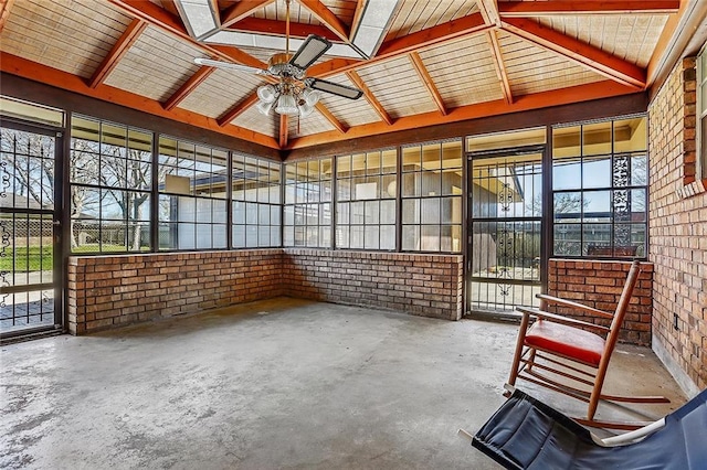 unfurnished sunroom featuring ceiling fan