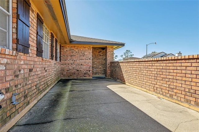 view of patio featuring fence