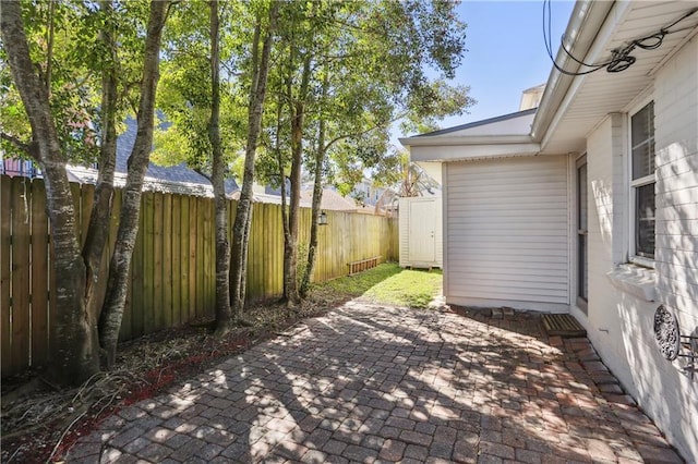 420 37th St, New Orleans, LA 70124 - view of patio / terrace featuring an outdoor structure, a fenced backyard, and a shed