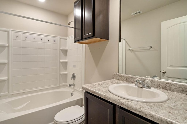 bathroom featuring visible vents, toilet,  shower combination, and vanity