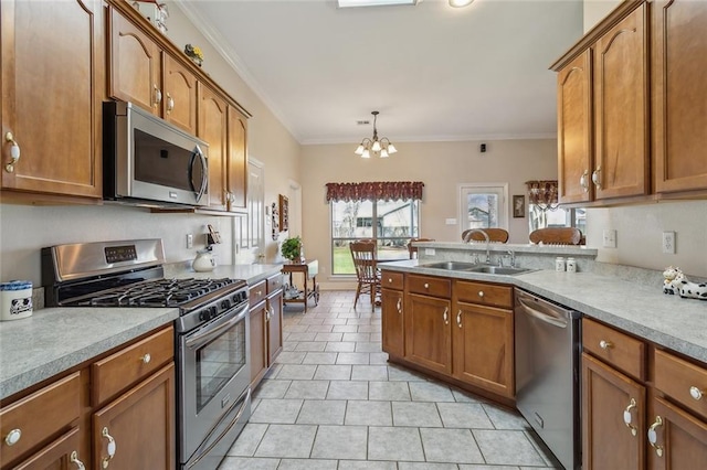 kitchen with brown cabinets, a sink, stainless steel appliances, light tile patterned flooring, and crown molding