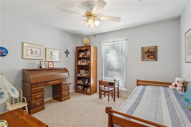 bedroom featuring light carpet, baseboards, and ceiling fan