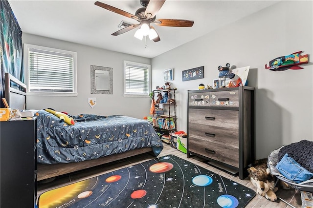 bedroom with visible vents and a ceiling fan