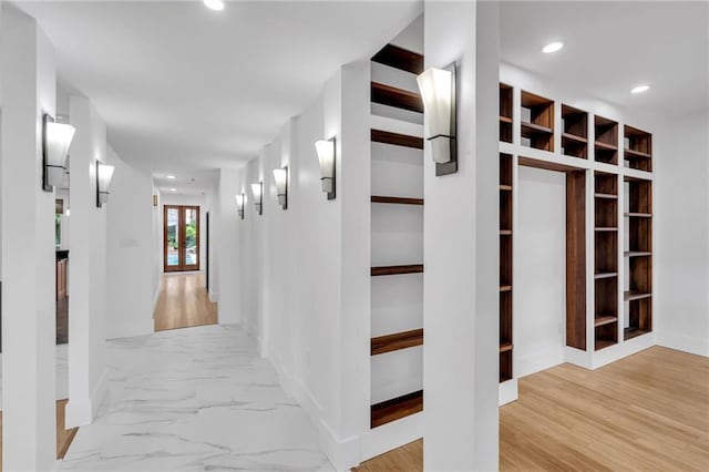 hall with wood finished floors and recessed lighting