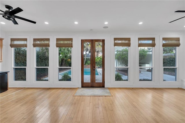 doorway featuring recessed lighting, french doors, light wood-type flooring, and a ceiling fan