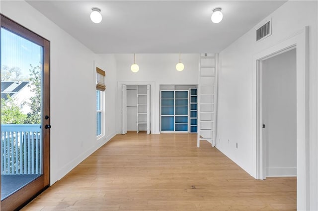 interior space featuring visible vents and light wood-type flooring