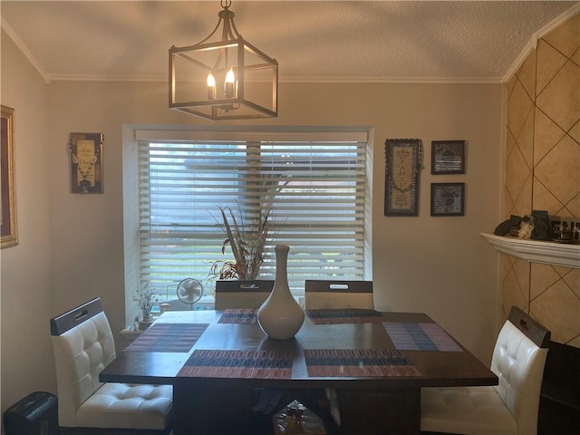 dining area with plenty of natural light, a chandelier, and ornamental molding