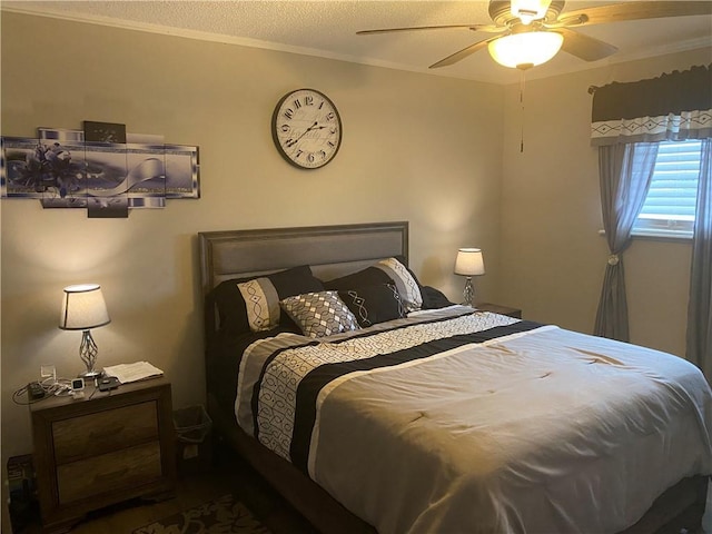 bedroom featuring ornamental molding and a ceiling fan