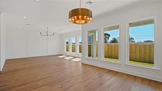 interior space with visible vents and a chandelier