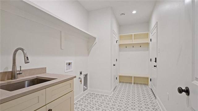 laundry area with visible vents, washer hookup, a sink, baseboards, and hookup for an electric dryer