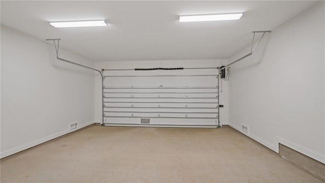 garage with visible vents and baseboards