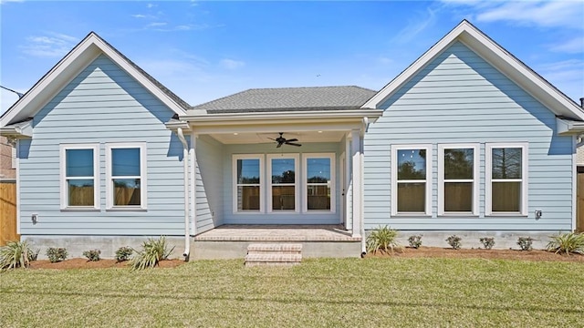 back of house with a yard, a patio area, and ceiling fan