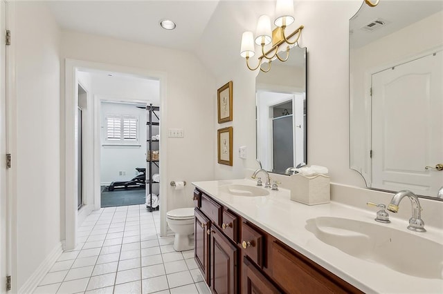 bathroom with tile patterned floors, visible vents, a shower stall, and a sink