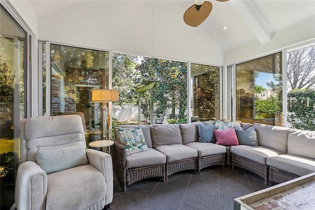 sunroom featuring lofted ceiling with beams and ceiling fan