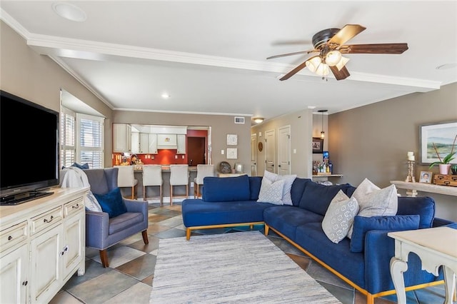 living room with crown molding and a ceiling fan