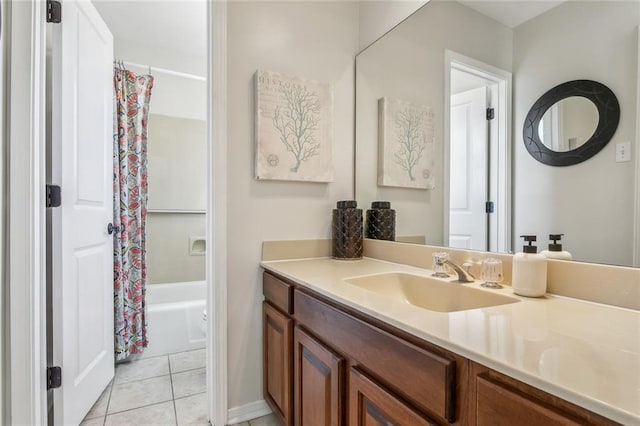 full bath featuring vanity, tile patterned floors, and shower / bath combo