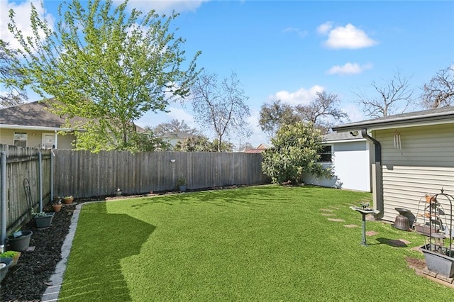 view of yard featuring a fenced backyard