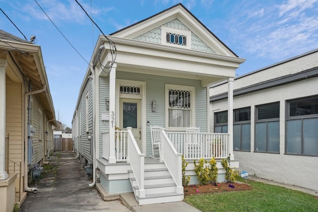 shotgun-style home with covered porch