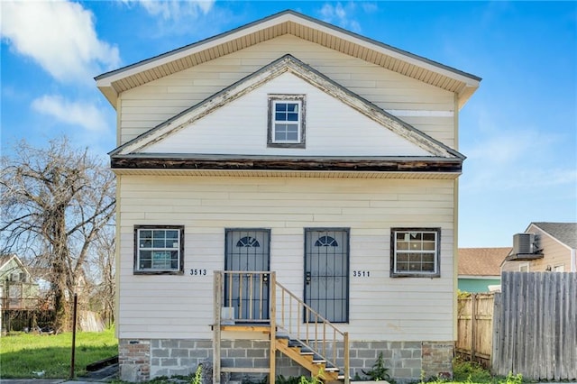 view of front of house with fence