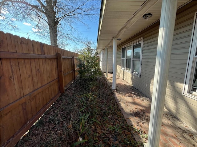 view of home's exterior with fence