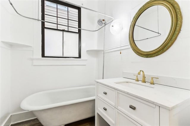 full bath featuring vanity, a soaking tub, and walk in shower