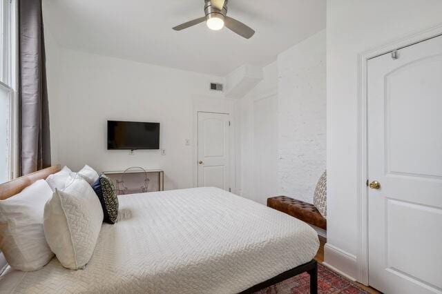 bedroom with visible vents and ceiling fan