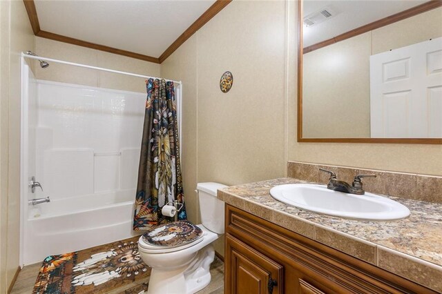 bathroom featuring visible vents, toilet, ornamental molding, shower / bath combination with curtain, and vanity