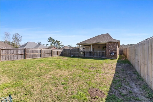 view of yard featuring a fenced backyard