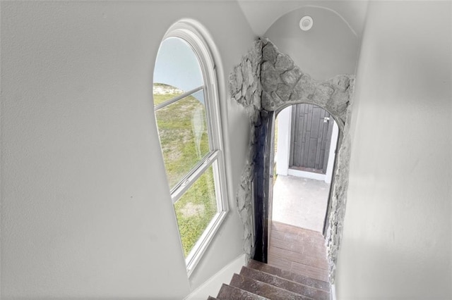 staircase with arched walkways