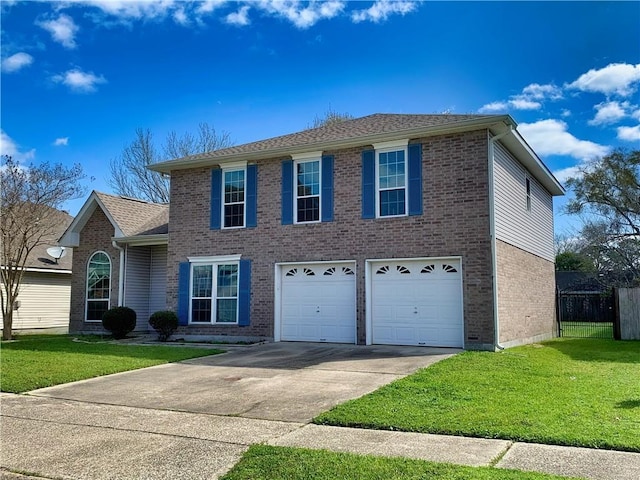 colonial home with a front lawn, an attached garage, brick siding, and concrete driveway