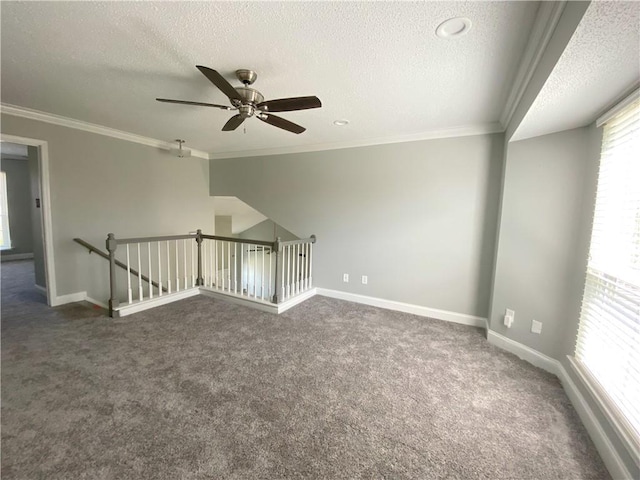 bonus room with ceiling fan, baseboards, dark carpet, and a textured ceiling