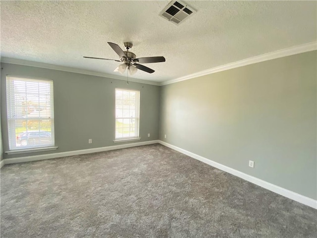 carpeted empty room featuring visible vents, baseboards, a textured ceiling, and crown molding