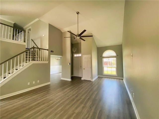 unfurnished living room with baseboards, stairs, wood finished floors, high vaulted ceiling, and a ceiling fan