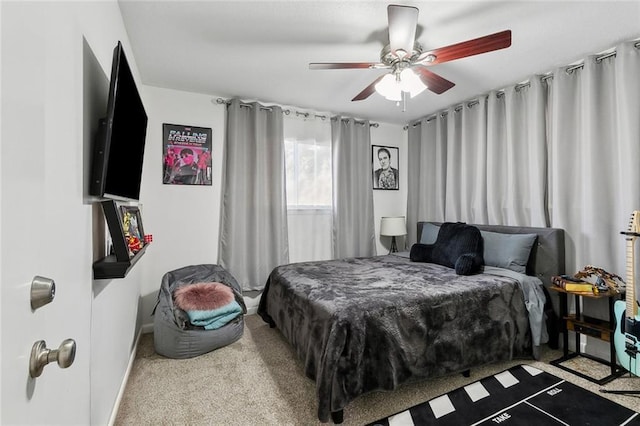 bedroom with a ceiling fan and carpet flooring