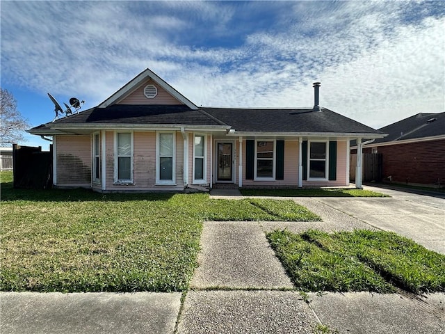 single story home with a front lawn and fence