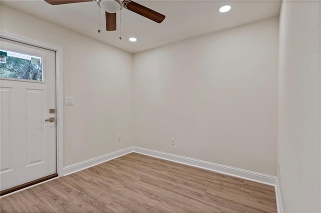 interior space featuring recessed lighting, ceiling fan, baseboards, and wood finished floors