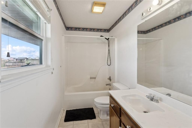 bathroom featuring tile patterned flooring, shower / washtub combination, toilet, and vanity