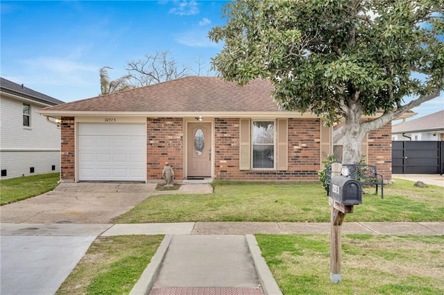 ranch-style home with brick siding, a shingled roof, a front lawn, a garage, and driveway